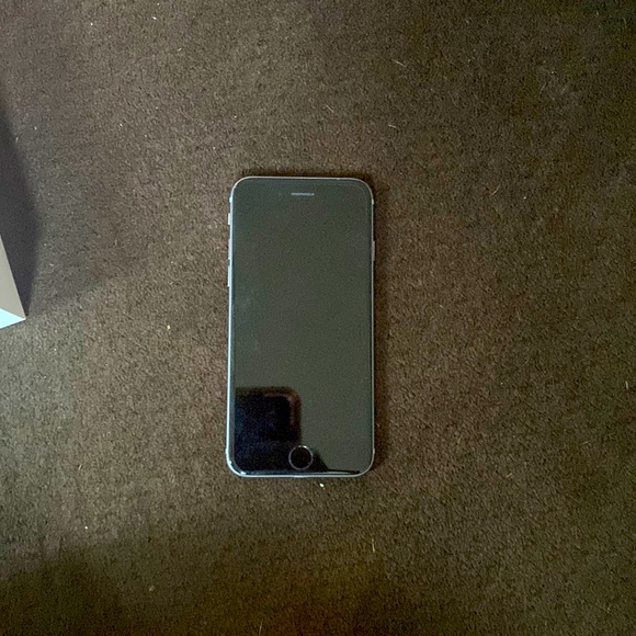 I’m selling an silver colored iPhone 6 with a new card inside of it.